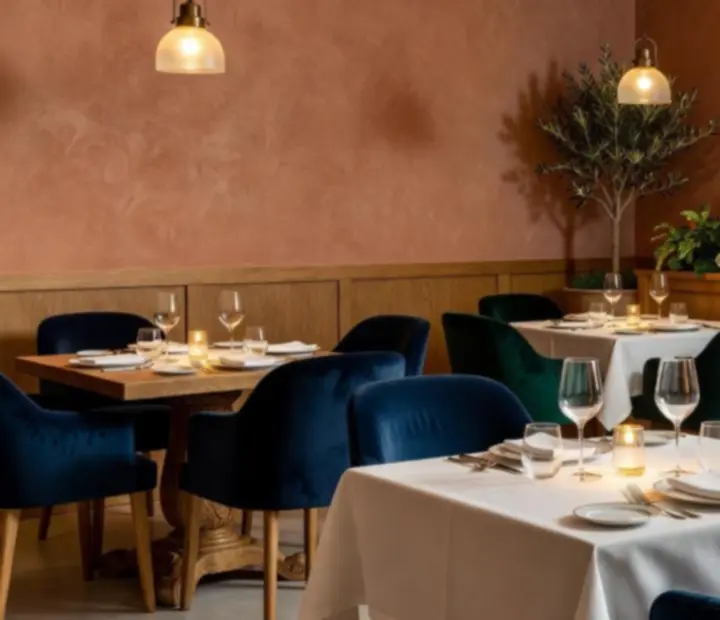 Ekskluzywna strefa VIP restauracji Velona Storia z eleganckimi stolikami i nastrojowym oświetleniem